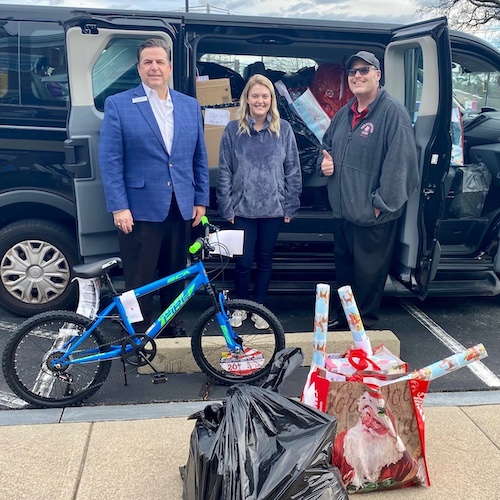 Group pictured in front of Angel Tree van